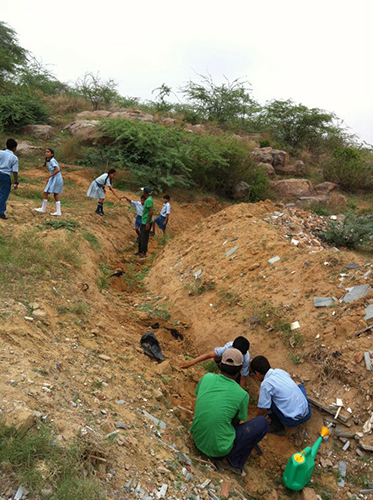 2012-7-26 at Aravali Biodiversity Park. Students planting