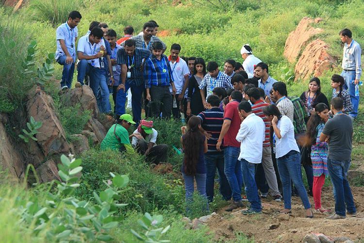 2013-8-23 GENPACT planting. It was a hot day and it didn't deter the senior leaders and other team members joining in reviving the forest..